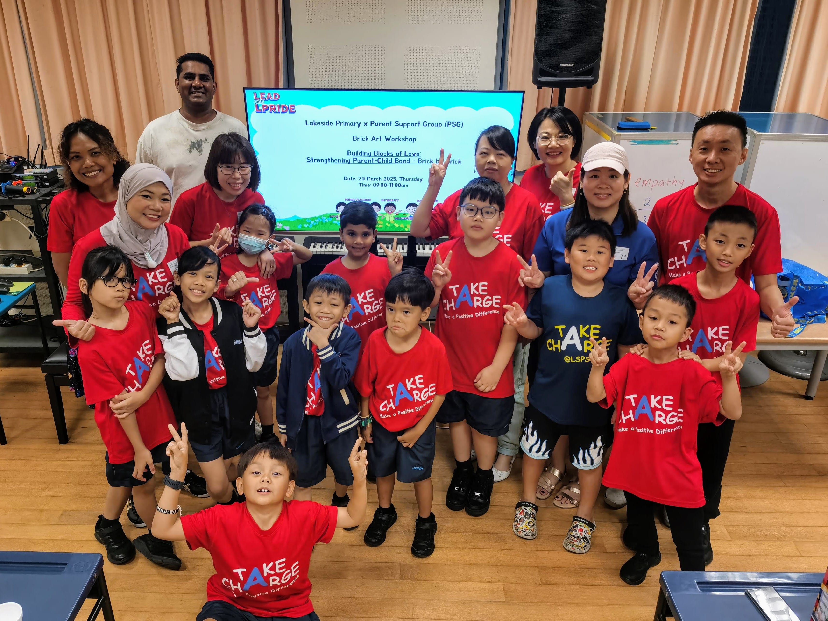 Our PSG Exco members with their children and PSG liaison teachers pose together for a group photo